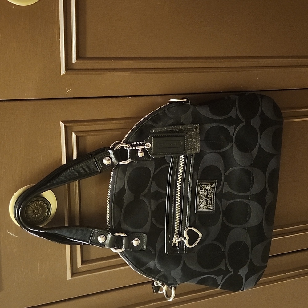 A Black Coach Purse wrist bag, cloth bag very nice medium in size